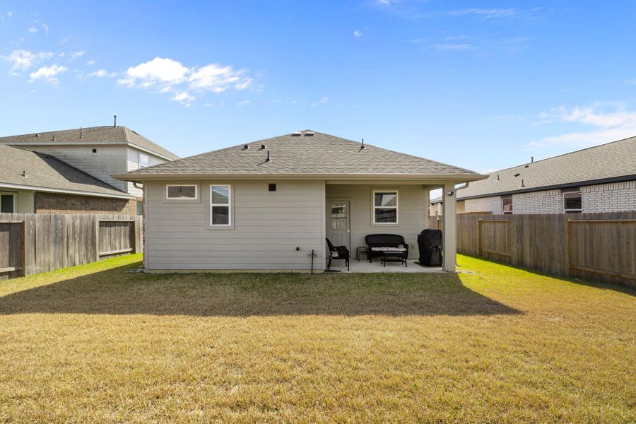 Exterior details and patio area of a home in , Iowa Colony (Image 23).