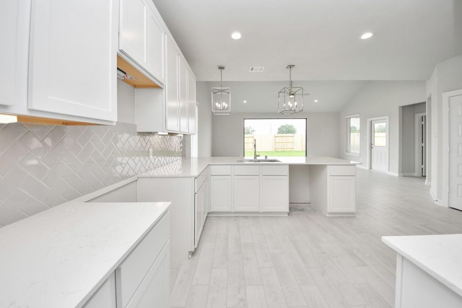 This generously spacious kitchen is a dream realized! Sample photo of completed home with similar floor plan. Actual colors and selections may vary. This generously spacious kitchen is a dream realized! Sample photo of completed home with similar floor plan. Actual colors and selections may vary.