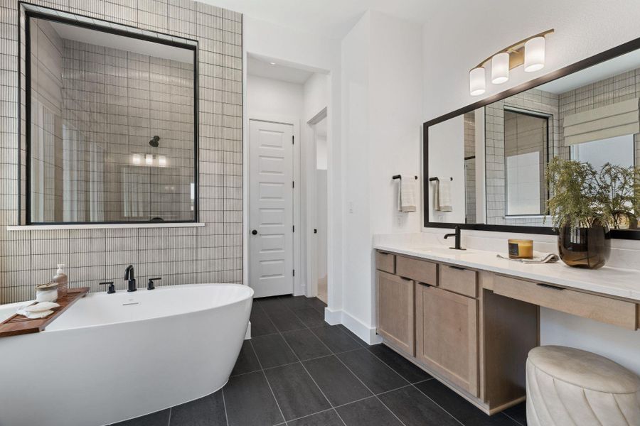 Primary Bath retreat with dual vanities, soaking tub & walk-in shower - Representative Photo