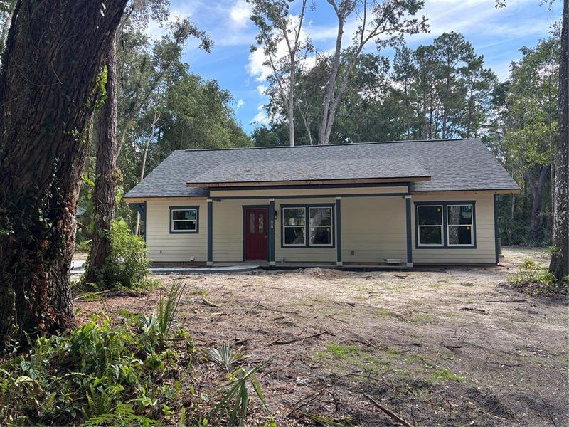 Front exterior of a new home in , Micanopy, FL, highlighting curb appeal (Image 17).