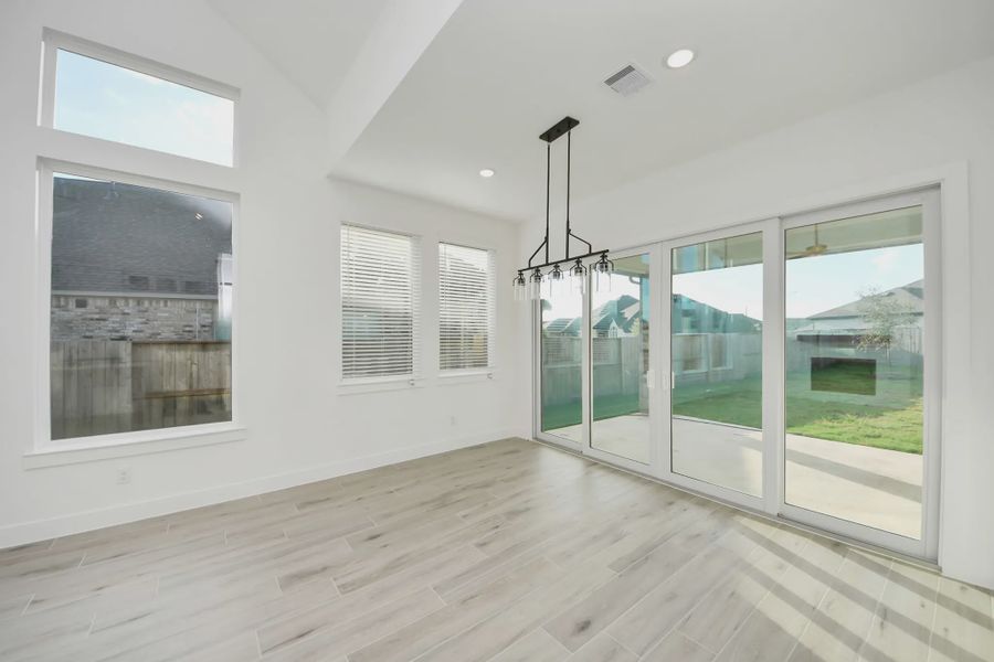 Representative unfurnished interior of a home built from the PT Bonneville by Chesmar Homes in Meridiana 50's and 60's, Manvel (Image 19).