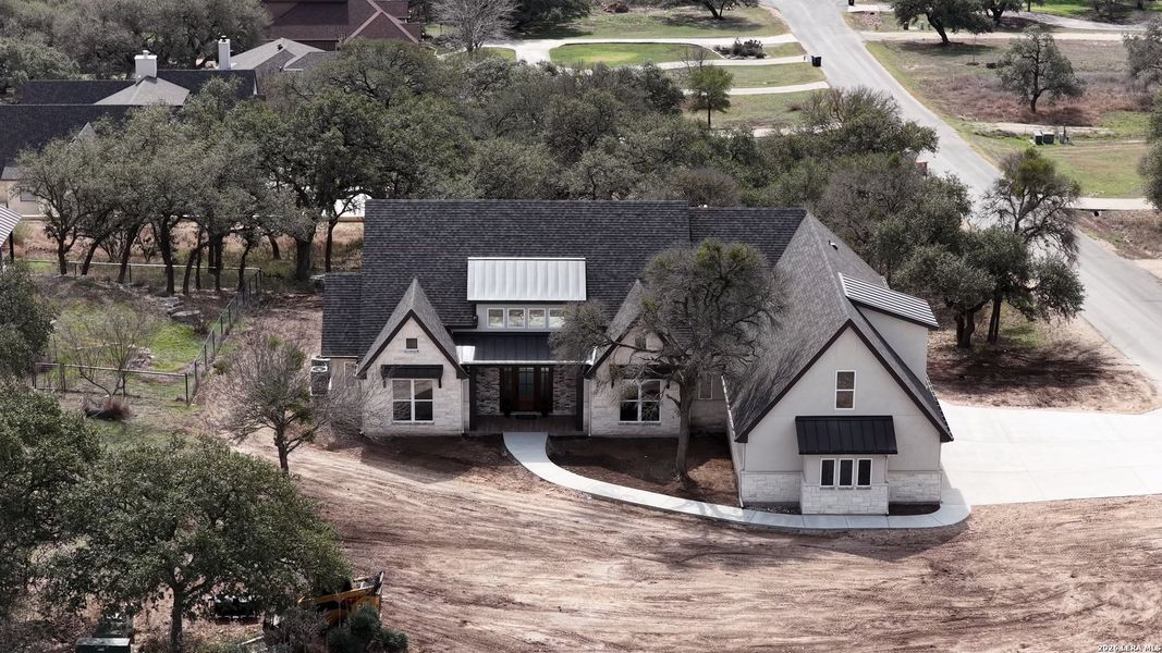 Front exterior of a new home in , New Braunfels, TX, highlighting curb appeal (Image 27). Front exterior of a new home in , New Braunfels, TX, highlighting curb appeal (Image 27).