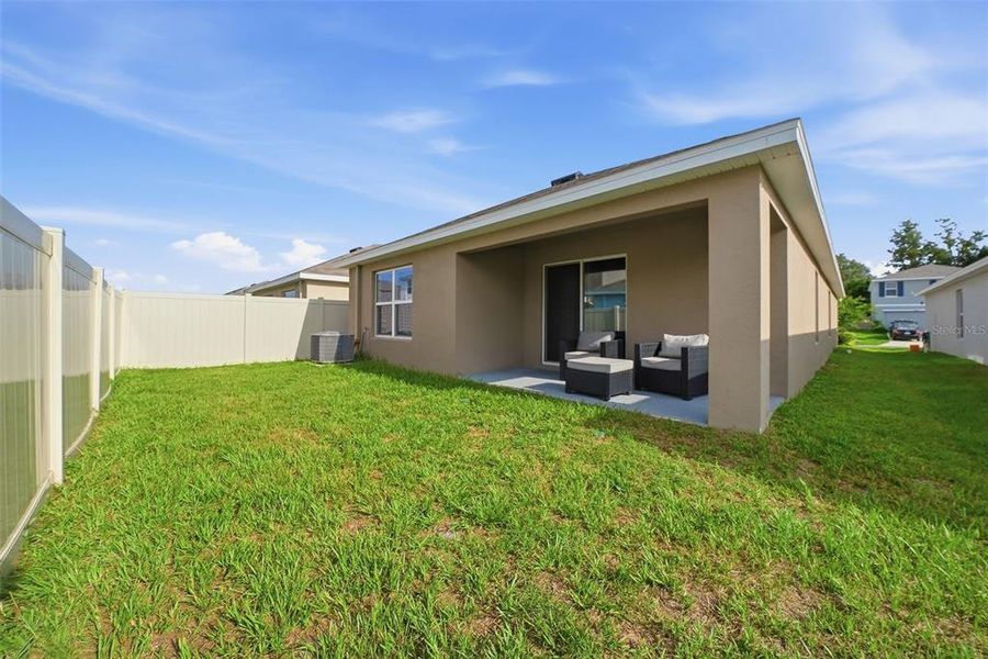 Exterior details and patio area of a home in Harvest Ridge, Zephyrhills (Image 23).