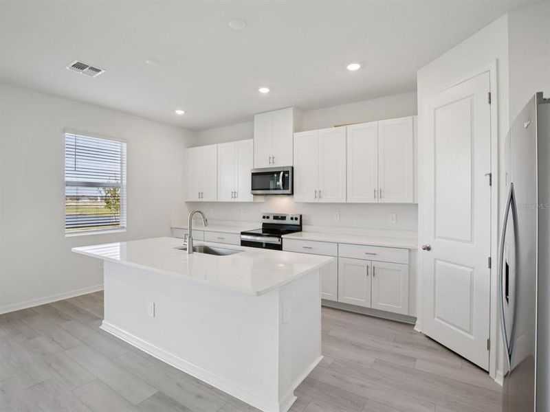 Furnished interior view inside a new home in Coasterra - Reserve Series, Palmetto (Image 4).