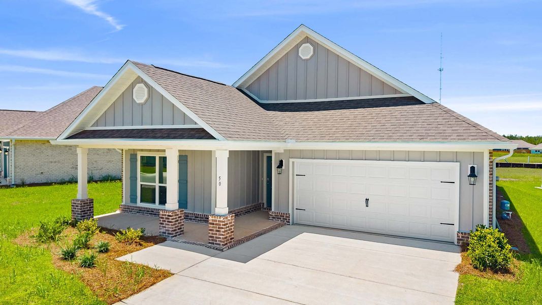 Front exterior of a new home in Owl's Head Farms, Freeport, FL, highlighting curb appeal (Image 2). Front exterior of a new home in Owl's Head Farms, Freeport, FL, highlighting curb appeal (Image 2).