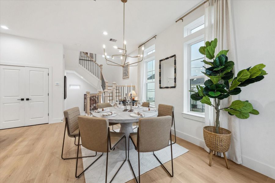 Dining area with designer chandelier and open flow Dining area with designer chandelier and open flow