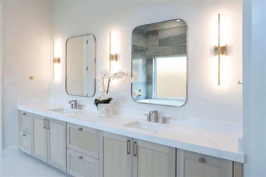 Bathroom with dual bowl vanity and tile floors