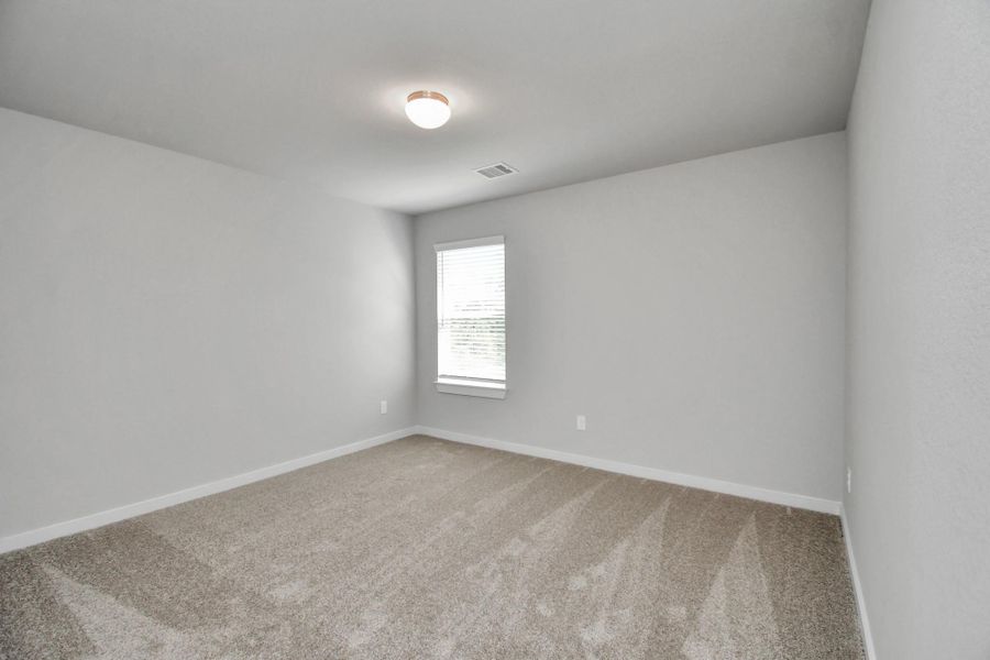 Generously sized secondary bedrooms featuring spacious closets, soft and inviting carpeting underfoot, large windows allowing plenty of natural light, and the added touch of privacy blinds for your personal retreat. Sample photo of completed home with similar floor plan. Actual colors and selections may vary. Generously sized secondary bedrooms featuring spacious closets, soft and inviting carpeting underfoot, large windows allowing plenty of natural light, and the added touch of privacy blinds for your personal retreat. Sample photo of completed home with similar floor plan. Actual colors and selections may vary.