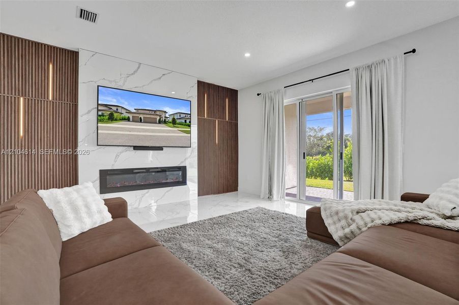 Feature wall with integrated lighting and a linear electric fireplace