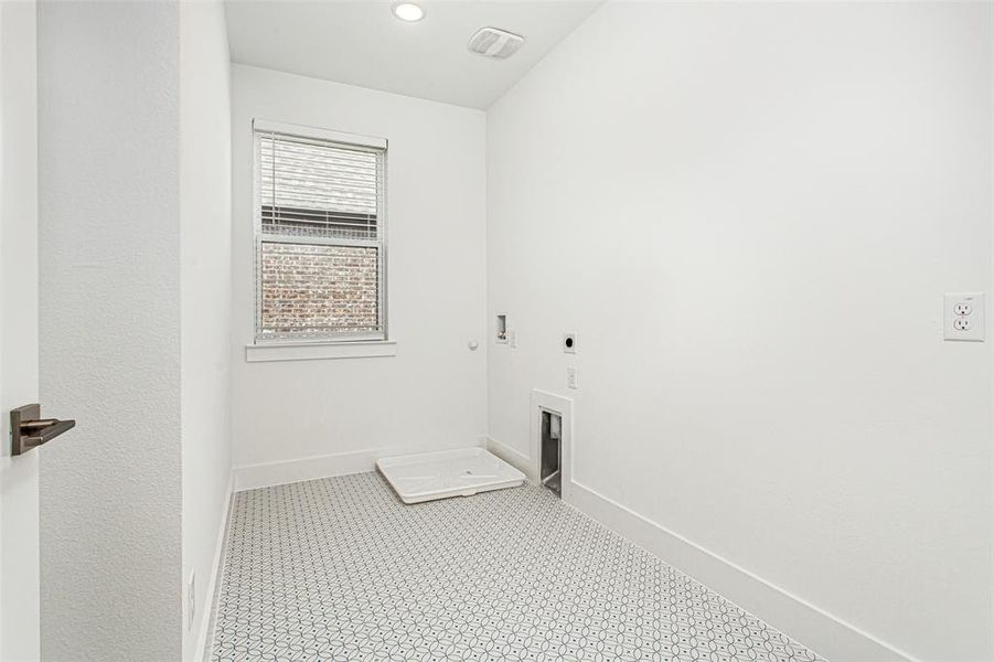 Laundry area with electric dryer hookup, recessed lighting, hookup for a gas dryer, and washer hookup