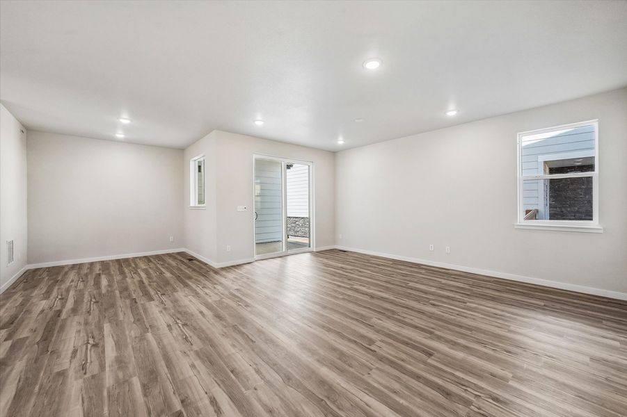 A room with a wood floor and a wood floor.
