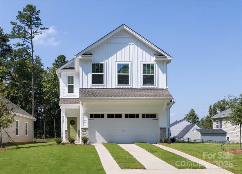 Front exterior of a new home in , Charlotte, NC, highlighting curb appeal (Image 20).