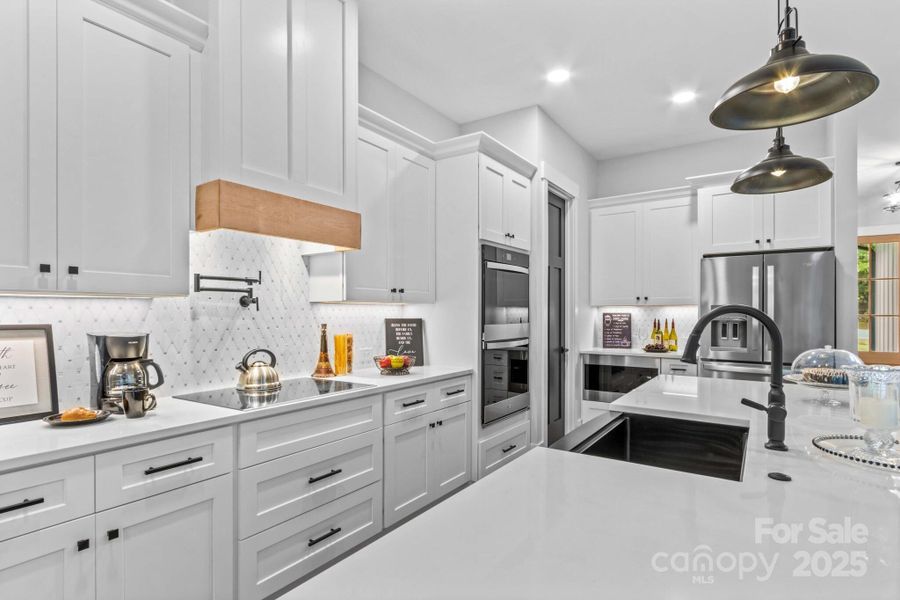 Gourmet Chef's Kitchen with all the bells & whistles for convenience & style.