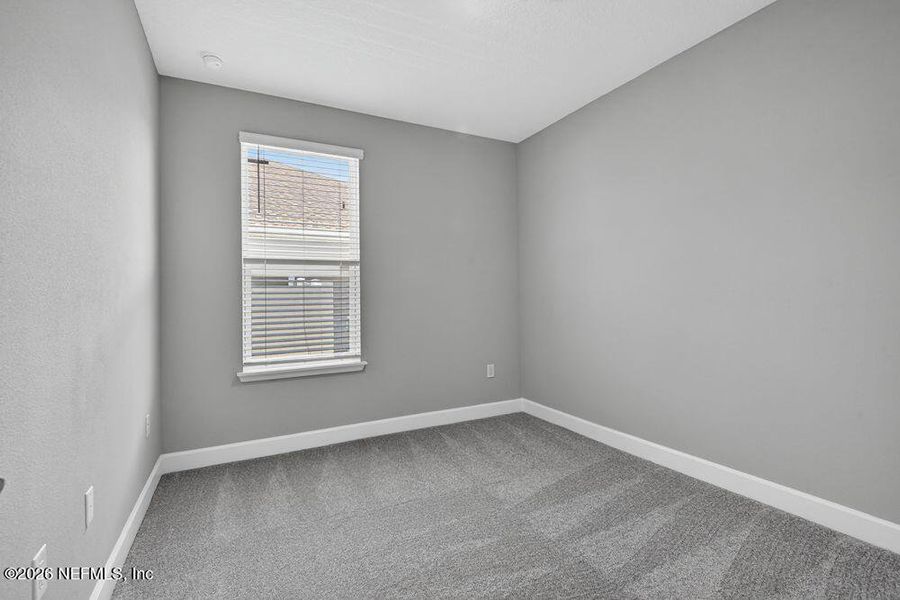 Spacious, unfurnished interior of a new home in Colbert Landings, Palm Coast (Image 32).