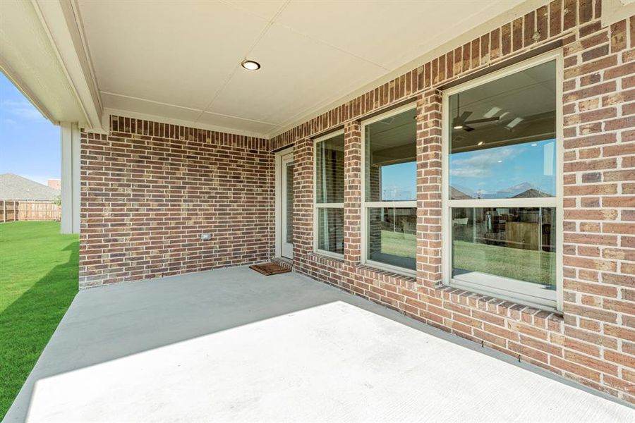 Exterior details and patio area of a home in West Crossing, Anna (Image 22). Exterior details and patio area of a home in West Crossing, Anna (Image 22).