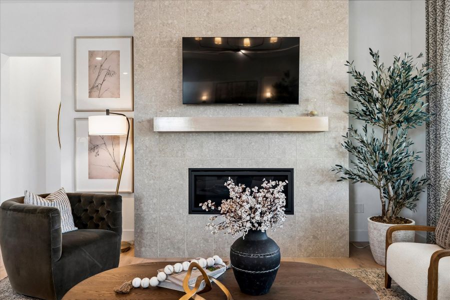 A living room with a fireplace.