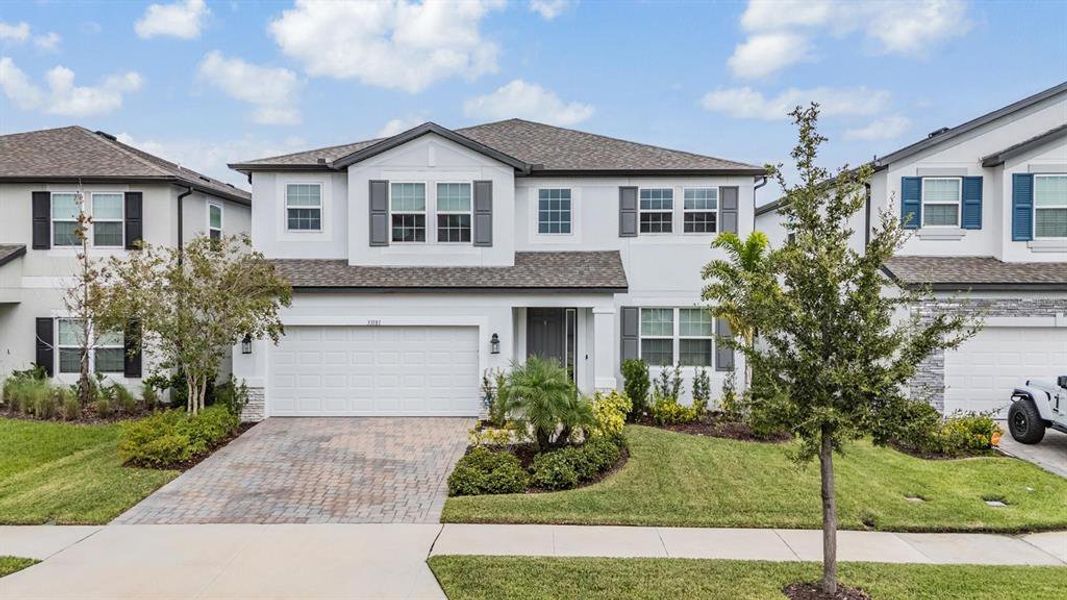 Front exterior of a new home in , Wesley Chapel, FL, highlighting curb appeal (Image 2).