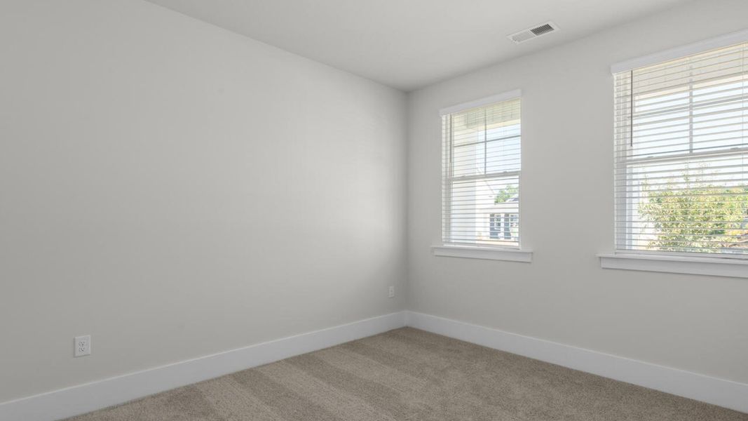 Spacious, unfurnished interior of a new home in Surfside Landing, Hubert (Image 26).