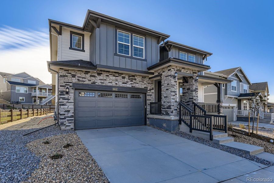 Front exterior of a new home in Newlin Crossing: The Monarch Collection, Parker, CO, highlighting curb appeal (Image 2).
