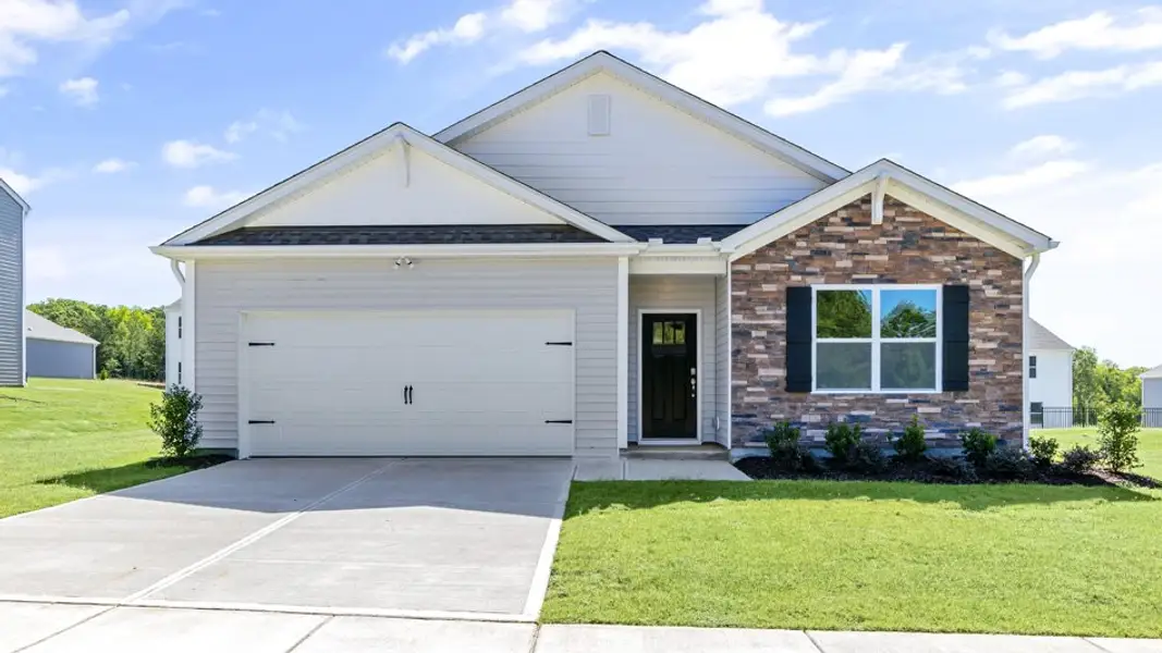 Front exterior of a new home in The Landing at Winston Pointe, Clayton, NC, highlighting curb appeal (Image 1). Front exterior of a new home in The Landing at Winston Pointe, Clayton, NC, highlighting curb appeal (Image 1).