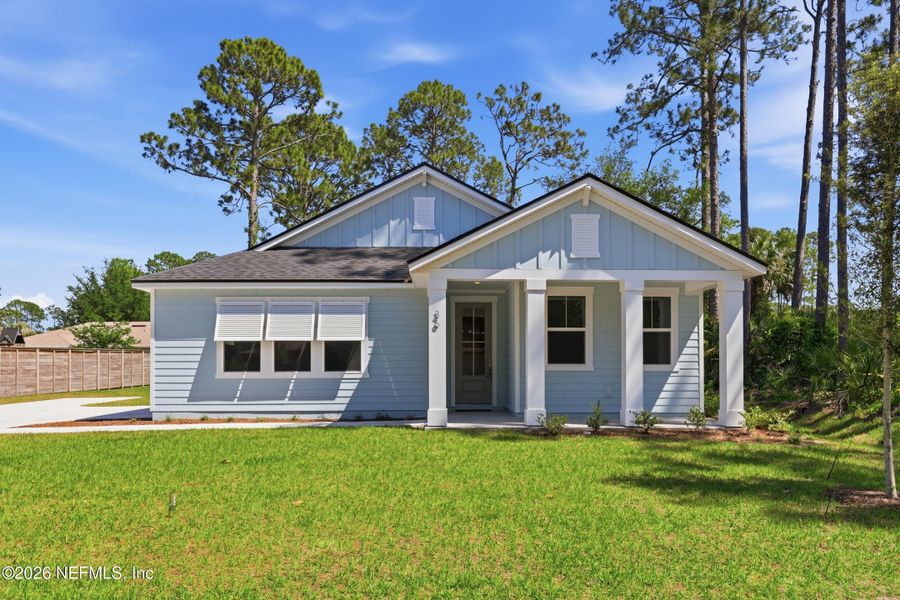 Front exterior of a new home in Palm Coast Homes, Palm Coast, FL, highlighting curb appeal (Image 28).