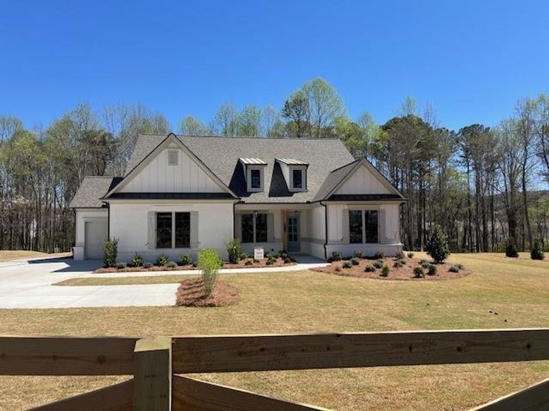 Front exterior of a new home in , Cumming, GA, highlighting curb appeal (Image 1). Front exterior of a new home in , Cumming, GA, highlighting curb appeal (Image 1).