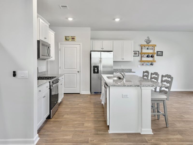 Furnished interior view inside a new home in Pine Hills at Cane Bay, Summerville (Image 11). Furnished interior view inside a new home in Pine Hills at Cane Bay, Summerville (Image 11).