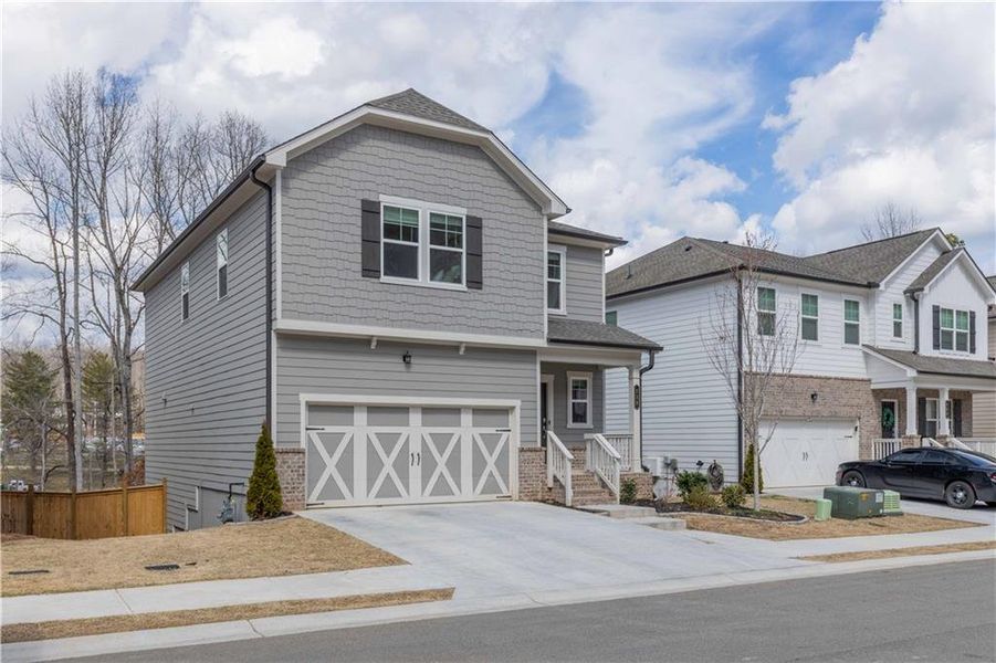 Front exterior of a new home in Creekside at Farmers Crossing, Ball Ground, GA, highlighting curb appeal (Image 23).