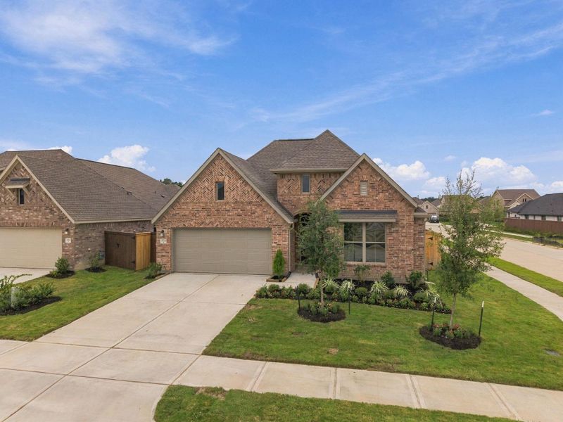 Front exterior of a new home in The Trails, New Caney, TX, highlighting curb appeal (Image 15). Front exterior of a new home in The Trails, New Caney, TX, highlighting curb appeal (Image 15).