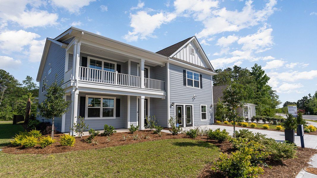 Representative exterior photo of a completed home built from the TILLMAN by D.R. Horton in Haven View, Murrells Inlet, SC (Image 24).