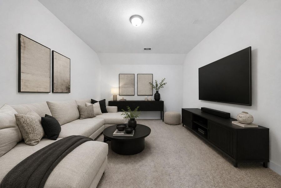 This media room is perfect for any home movie night or to watch the big game! *This photo has been virtually staged