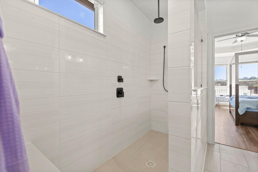 Full bathroom featuring ensuite bath and a walk in shower