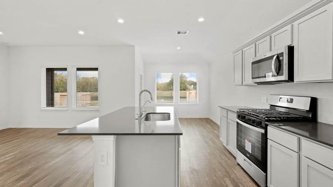 Representative image provided by builder. Subject home will have white countertops.