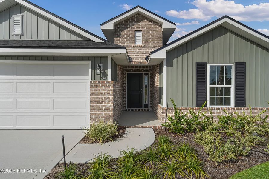 Exterior details and patio area of a home in Shadow Crest at Rolling Hills, Green Cove Springs (Image 3).