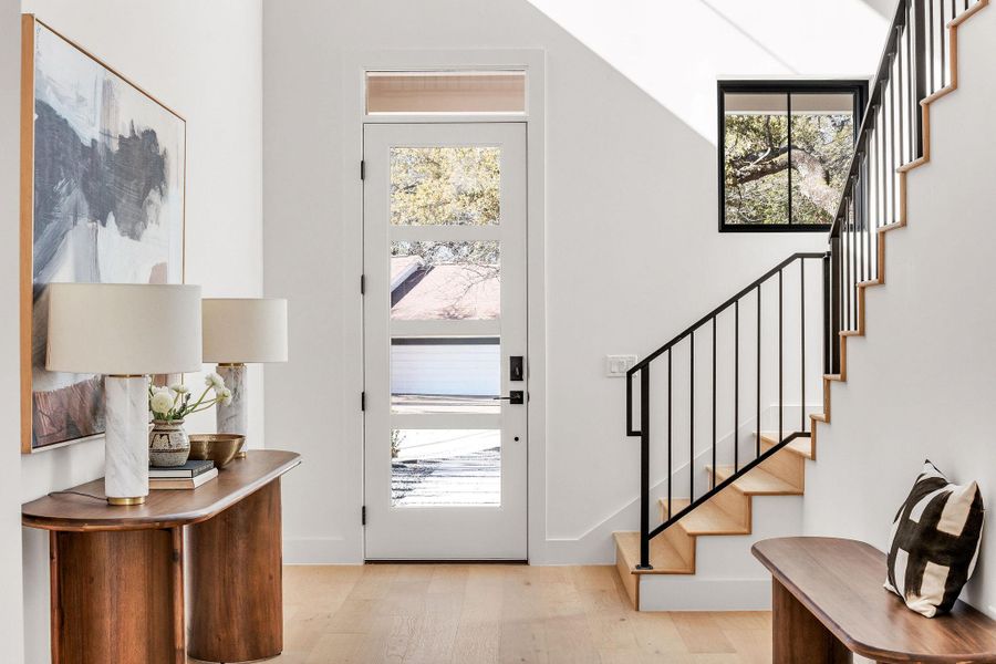 Entryway with light wood-style floors and plenty of natural light