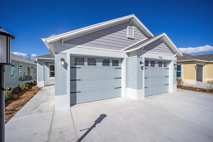 Representative exterior photo of a completed home built from the Charlotte by The Villages in The Villages/Courtyard Villas, The Villages, FL (Image 2). Representative exterior photo of a completed home built from the Charlotte by The Villages in The Villages/Courtyard Villas, The Villages, FL (Image 2).