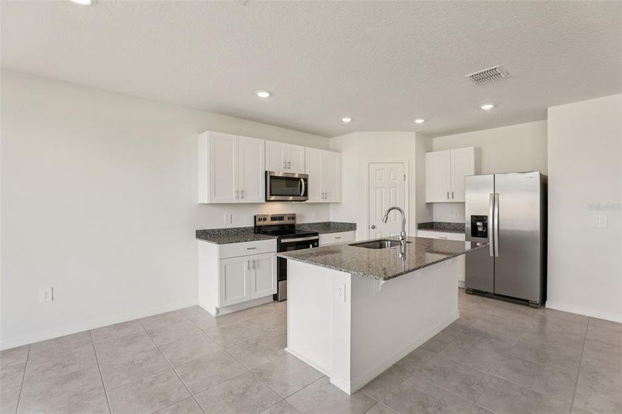 Furnished interior view inside a new home in Lawson Dunes - Signature Series, Haines City (Image 6).