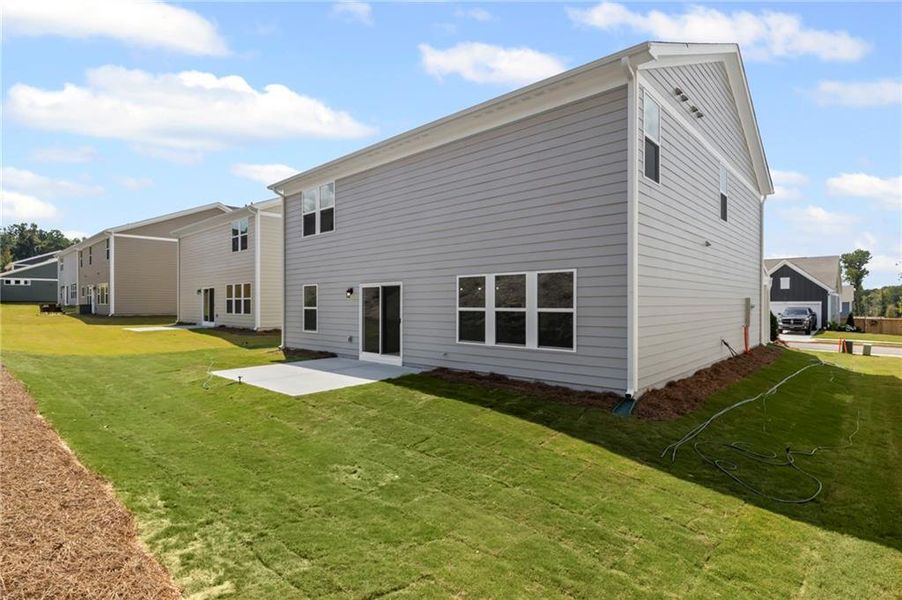 Front exterior of a new home in Sage Woods, Dallas, GA, highlighting curb appeal (Image 21). Front exterior of a new home in Sage Woods, Dallas, GA, highlighting curb appeal (Image 21).
