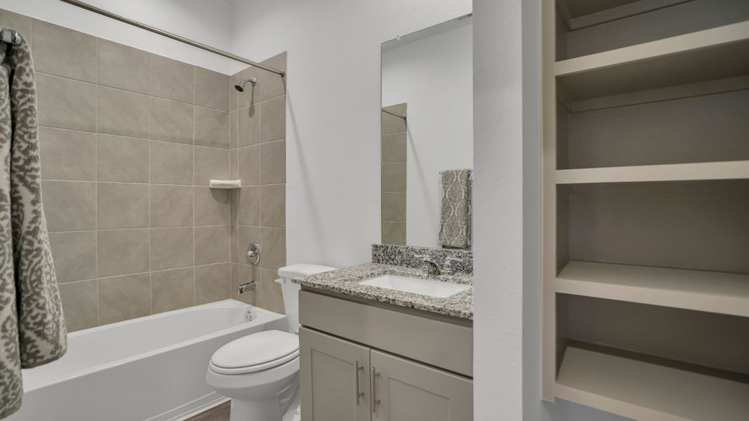Representative furnished interior of a home built from the MITCHELL by D.R. Horton in Westward Pointe, Sealy (Image 17).