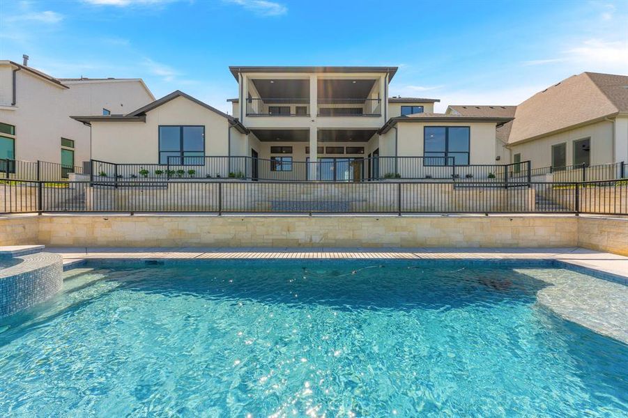 Front exterior of a new home in The Resort on Eagle Mt. Lake, Fort Worth, TX, highlighting curb appeal (Image 23). Front exterior of a new home in The Resort on Eagle Mt. Lake, Fort Worth, TX, highlighting curb appeal (Image 23).