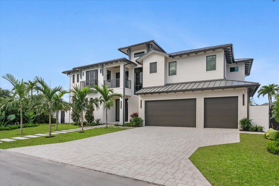 Front exterior of a new home in , Delray Beach, FL, highlighting curb appeal (Image 32). Front exterior of a new home in , Delray Beach, FL, highlighting curb appeal (Image 32).