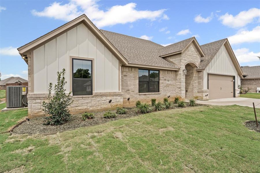 Front exterior of a new home in , Springtown, TX, highlighting curb appeal (Image 23). Front exterior of a new home in , Springtown, TX, highlighting curb appeal (Image 23).