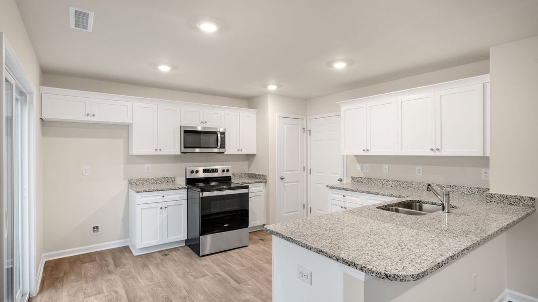 Furnished interior view inside a new home in Hobbs Farm, Ayden (Image 6).