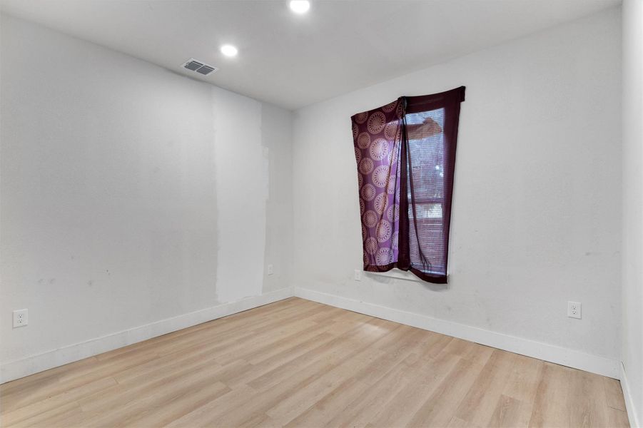 Unfurnished room featuring wood finished floors and recessed lighting Unfurnished room featuring wood finished floors and recessed lighting