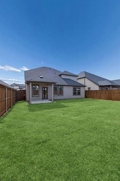 Covered Patio in the Masters home plan by Trophy Signature Homes – REPRESENTATIVE PHOTO