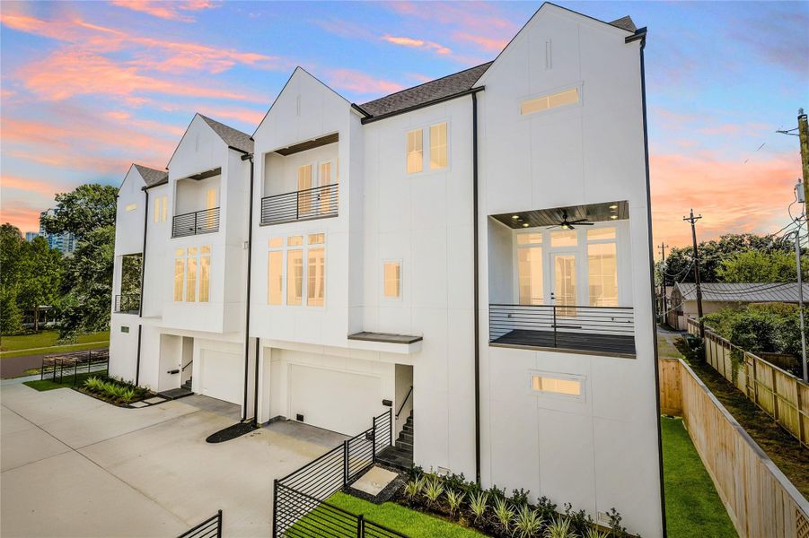 Sleek modern elevation featuring durable cement board siding, energy-efficient windows, and private fenced yard. Multiple balconies and refined architectural lines define this luxury residence minutes from the Texas Medical Center. Sleek modern elevation featuring durable cement board siding, energy-efficient windows, and private fenced yard. Multiple balconies and refined architectural lines define this luxury residence minutes from the Texas Medical Center.