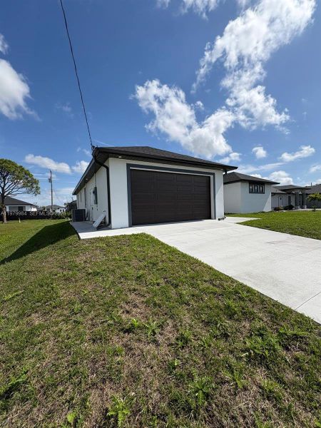 Front exterior of a new home in , Cape Coral, FL, highlighting curb appeal (Image 13).