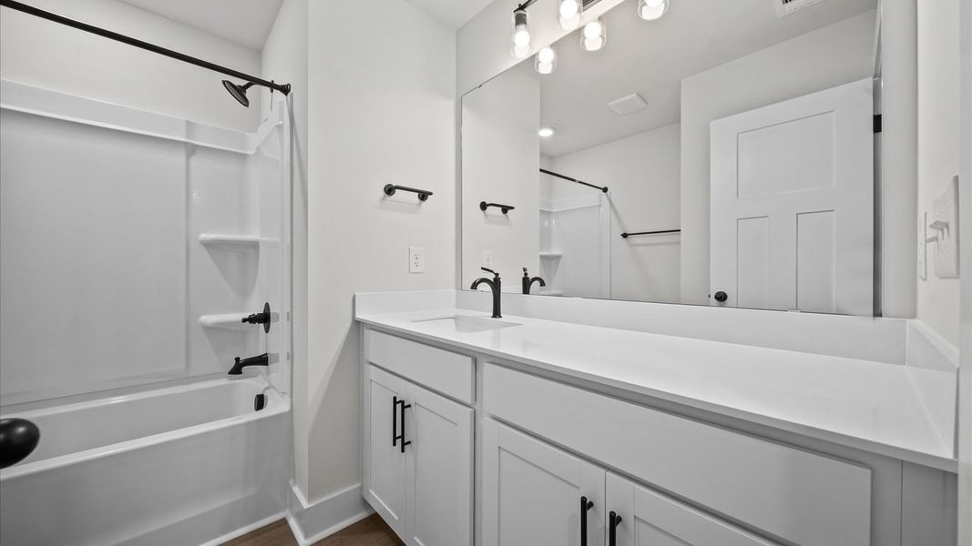 Extended countertop vanity in secondary bathroom in two story townhome at Ransdell Pointe by DRB Homes in Spartanburg, SC Extended countertop vanity in secondary bathroom in two story townhome at Ransdell Pointe by DRB Homes in Spartanburg, SC