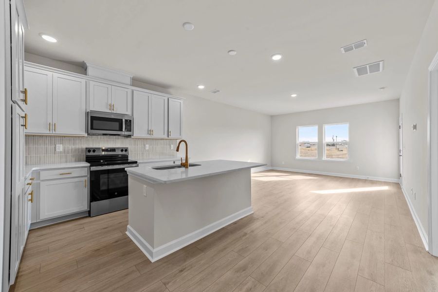 Furnished interior view inside a new home in Blue Heron Retreat, Little River (Image 6).