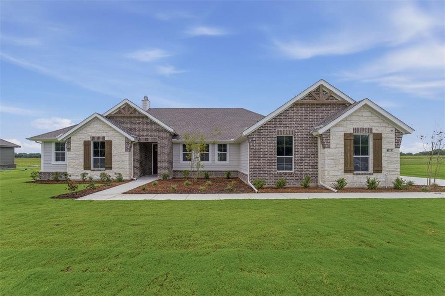 Ranch-style residence featuring a combination of brick, stone, and horizontal siding Ranch-style residence featuring a combination of brick, stone, and horizontal siding
